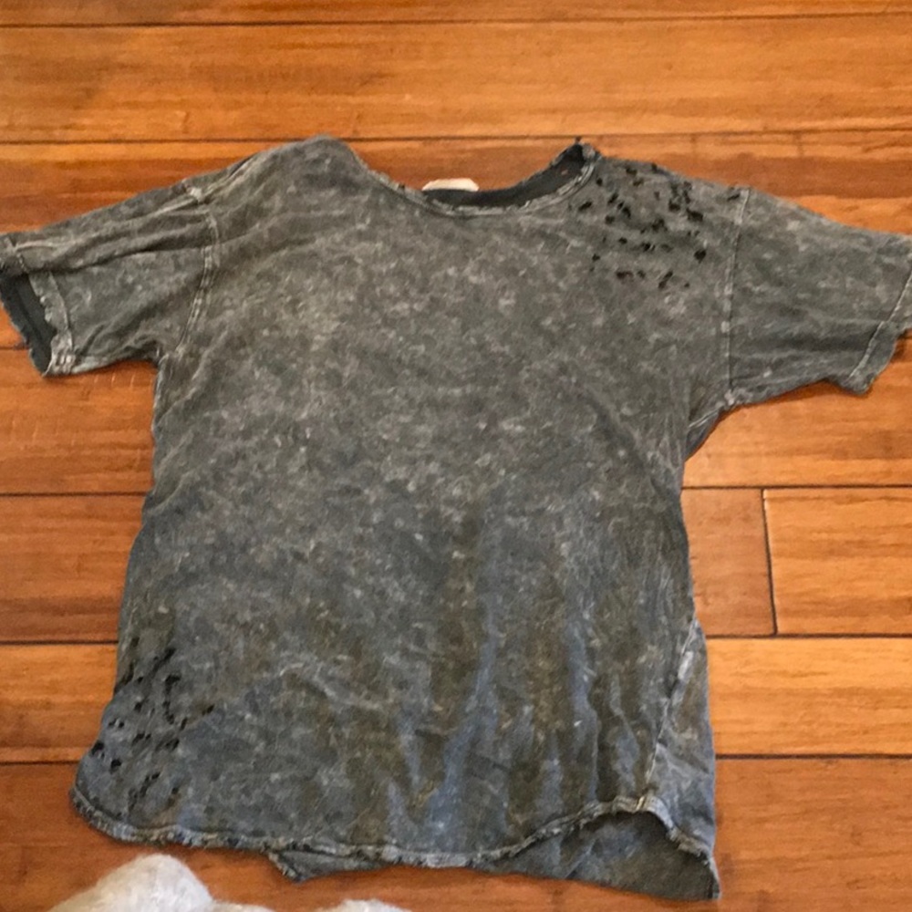 Phil Love edgy disheveled holed shirt